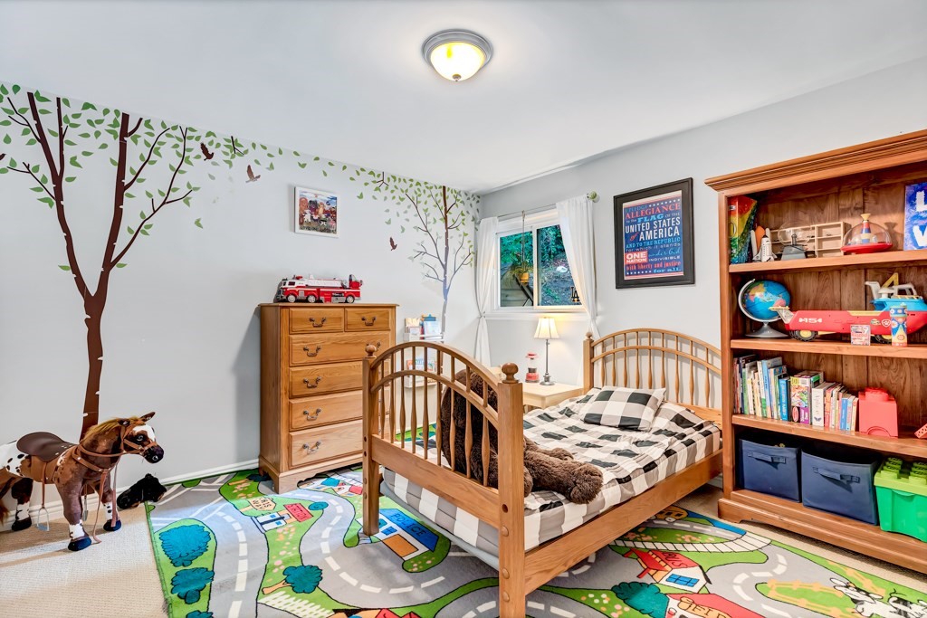 2601 Sunnyside Ridge Road Rancho Palos Verdes, CA 90275 - Photo 27 of 47 a bedroom with furniture a baby crib and a couch