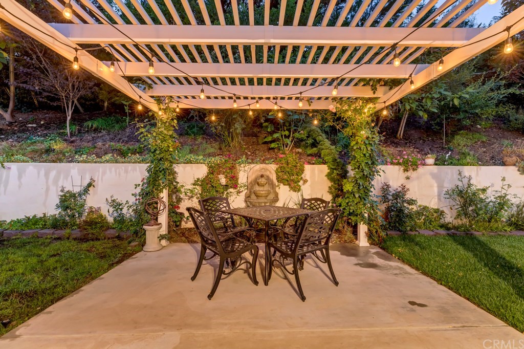 2601 Sunnyside Ridge Road Rancho Palos Verdes, CA 90275 - Photo 32 of 47 a view of a porch with a table and chairs