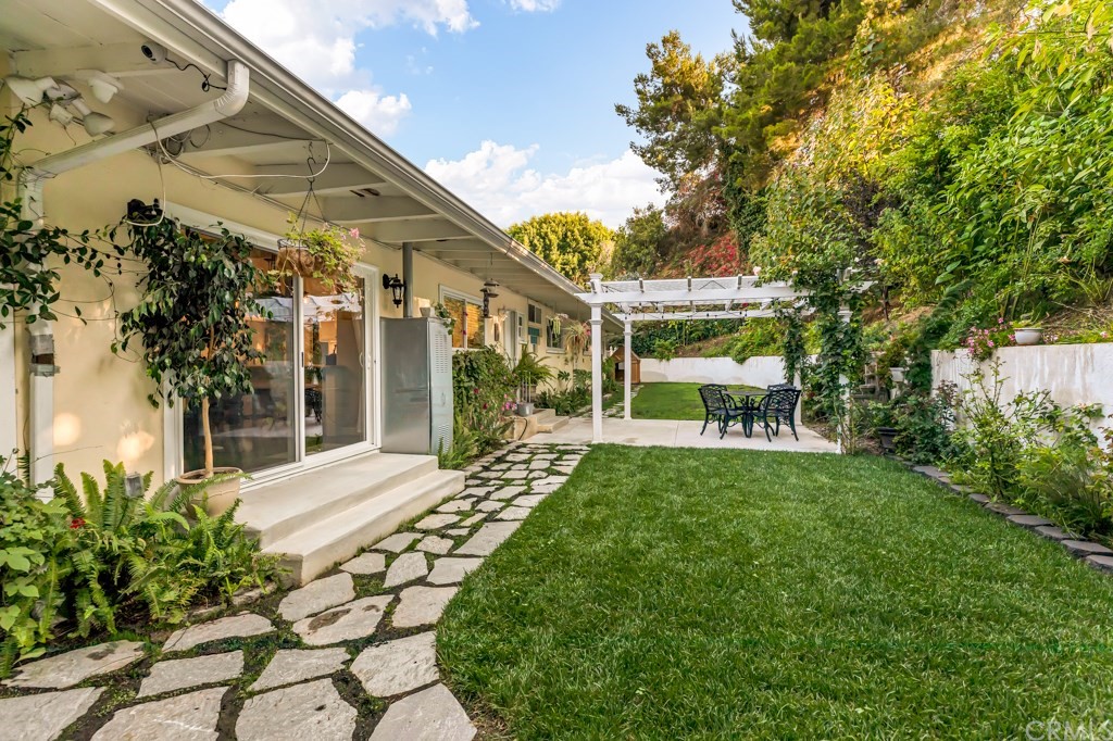 2601 Sunnyside Ridge Road Rancho Palos Verdes, CA 90275 - Photo 38 of 47 a front view of a house with a yard