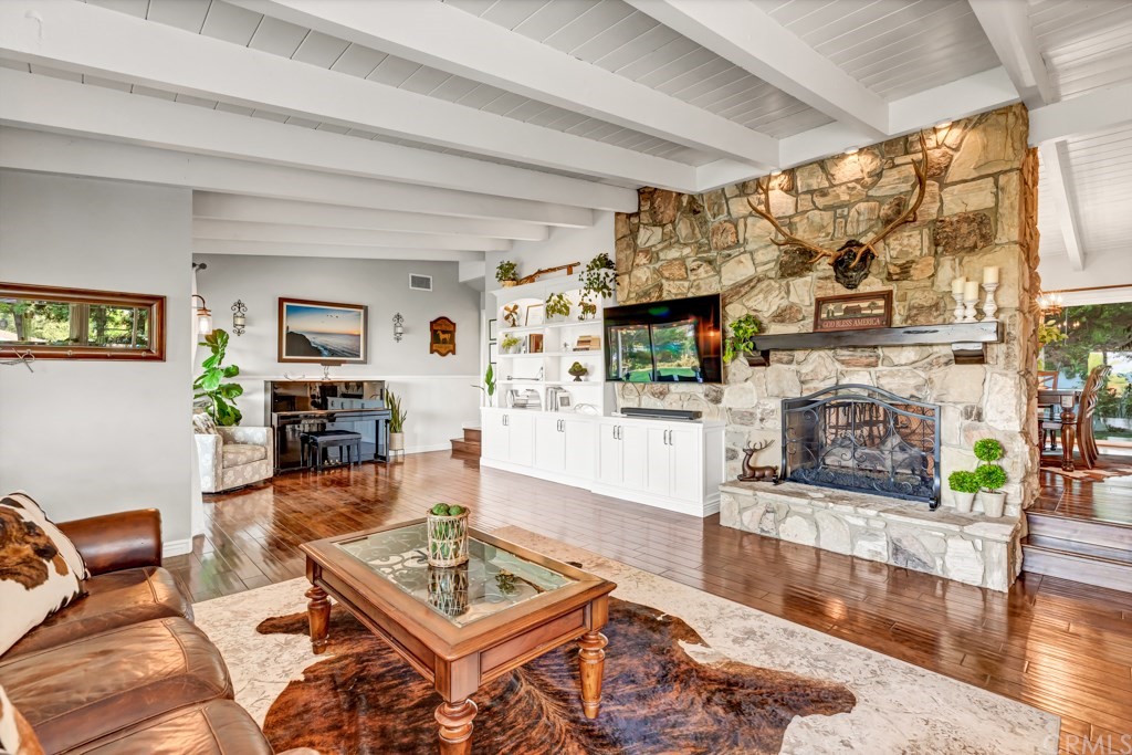 2601 Sunnyside Ridge Road Rancho Palos Verdes, CA 90275 - Photo 5 of 47 a living room with furniture and a fireplace