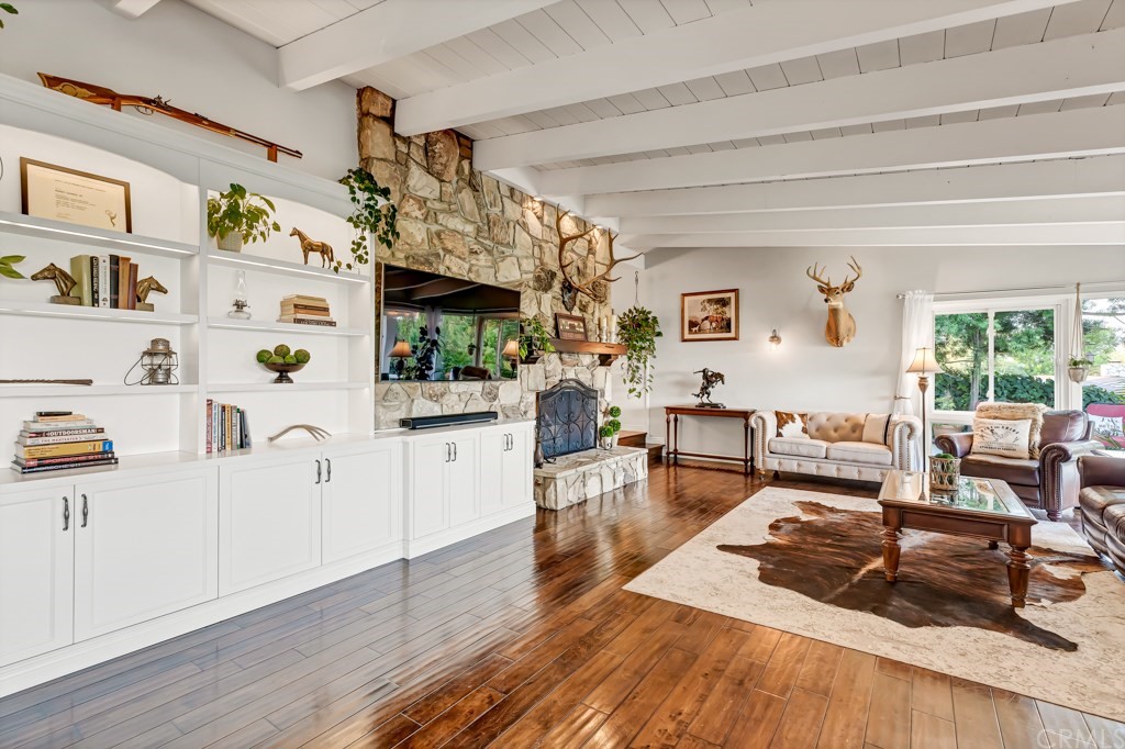 2601 Sunnyside Ridge Road Rancho Palos Verdes, CA 90275 - Photo 6 of 47 a living room with furniture and a wooden floor