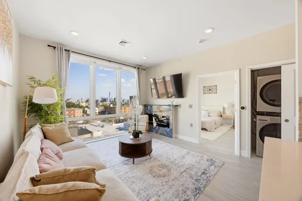 a living room with furniture potted plant and a couch