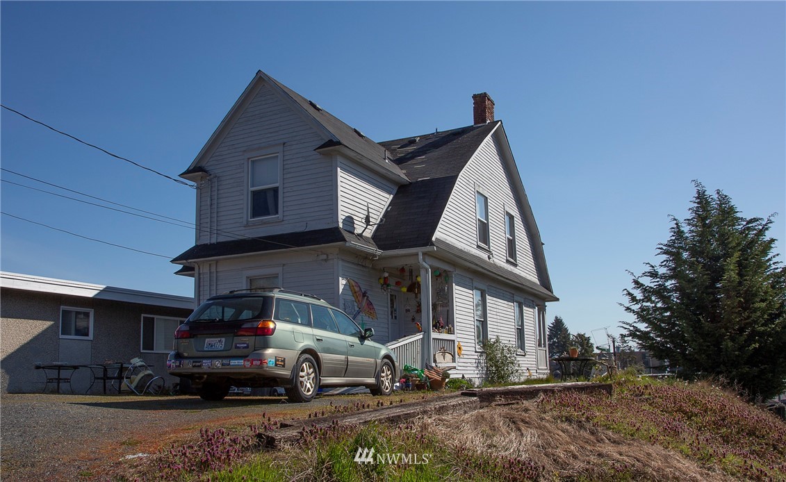 3430 Rucker Avenue Everett, WA 98201 - Photo 2 of 11 a car parked in front of a house