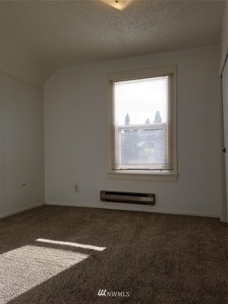 3430 Rucker Avenue Everett, WA 98201 - Photo 8 of 11 a view of a room with wooden floor and a window