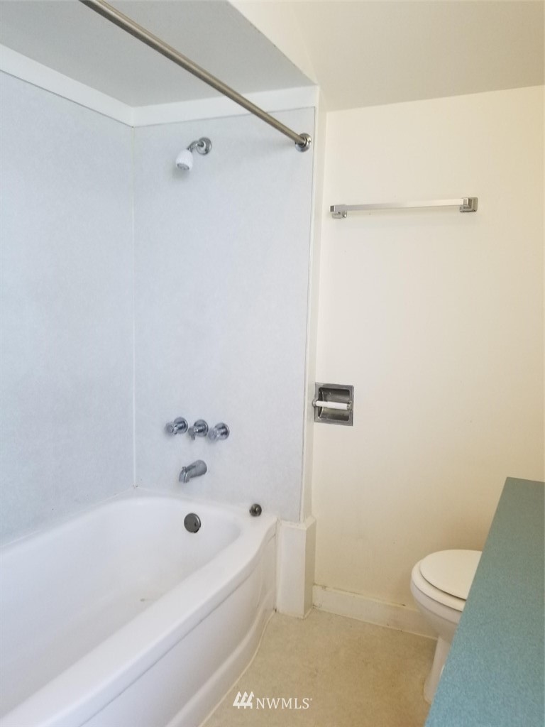 3430 Rucker Avenue Everett, WA 98201 - Photo 10 of 11 a bathroom with a bathtub and a toilet