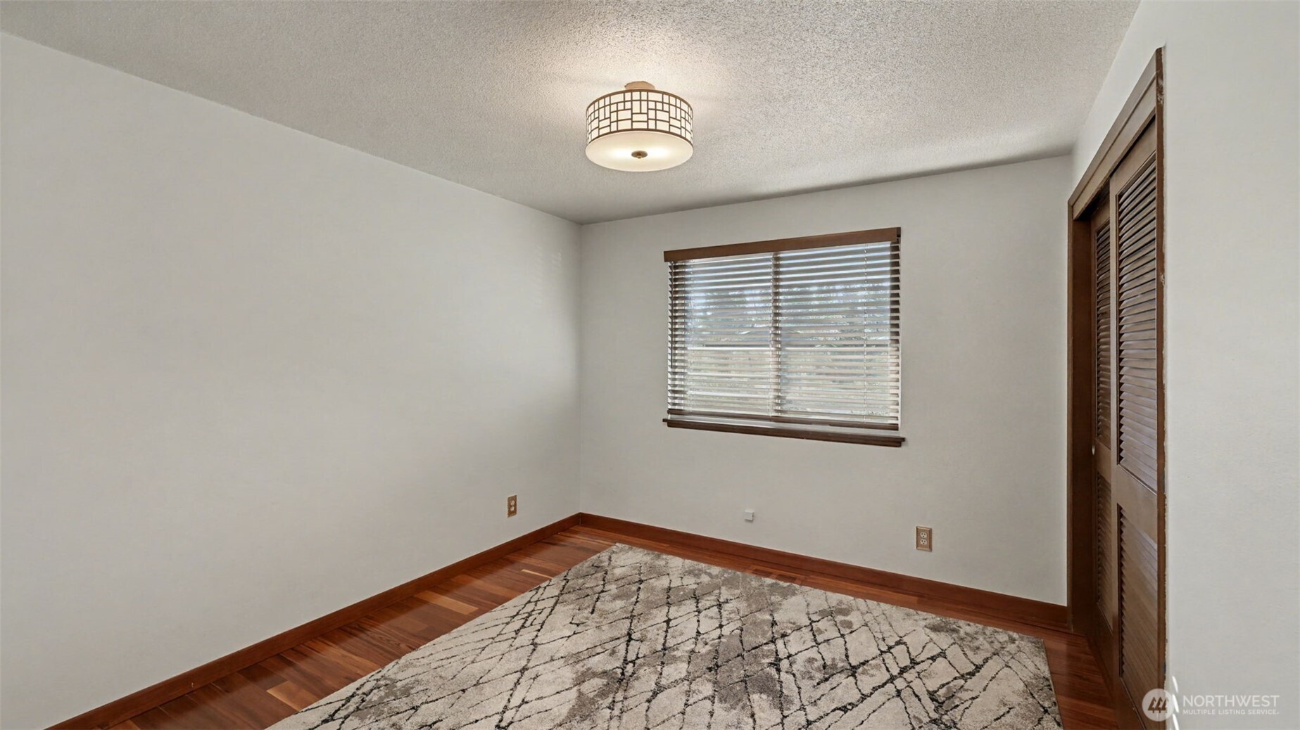 14604 Southeast 167th Place Renton, WA 98058 - Photo 13 of 23 a view of a room with wooden floor and a window