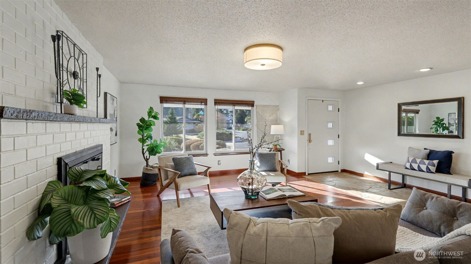 14604 Southeast 167th Place Renton, WA 98058 - Photo 2 of 23 a living room with furniture and a fireplace