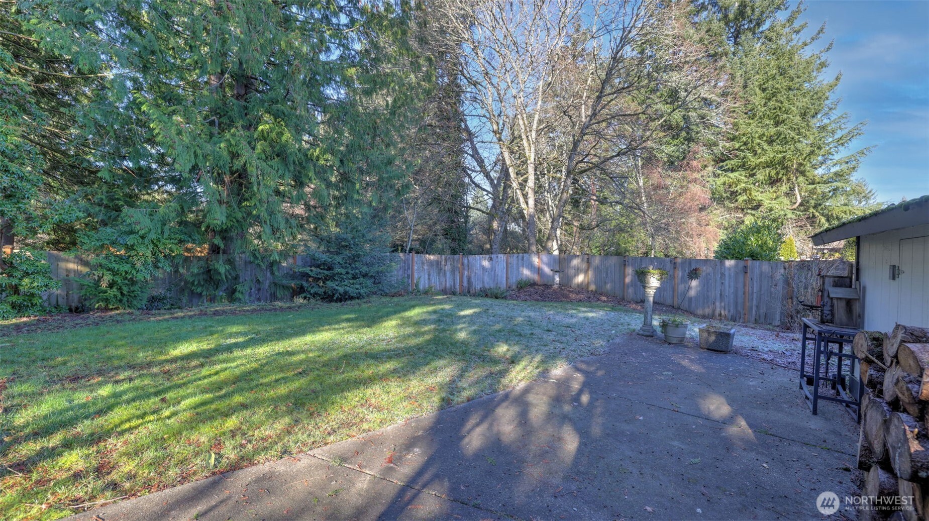 14604 Southeast 167th Place Renton, WA 98058 - Photo 21 of 23 a backyard with table and chairs and wooden fence
