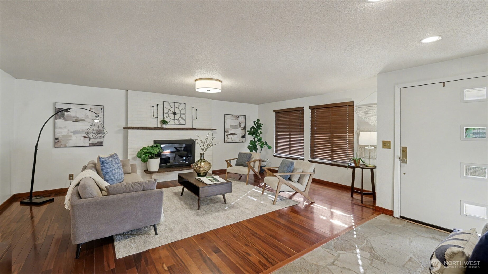 14604 Southeast 167th Place Renton, WA 98058 - Photo 3 of 23 a living room with fireplace furniture and a window