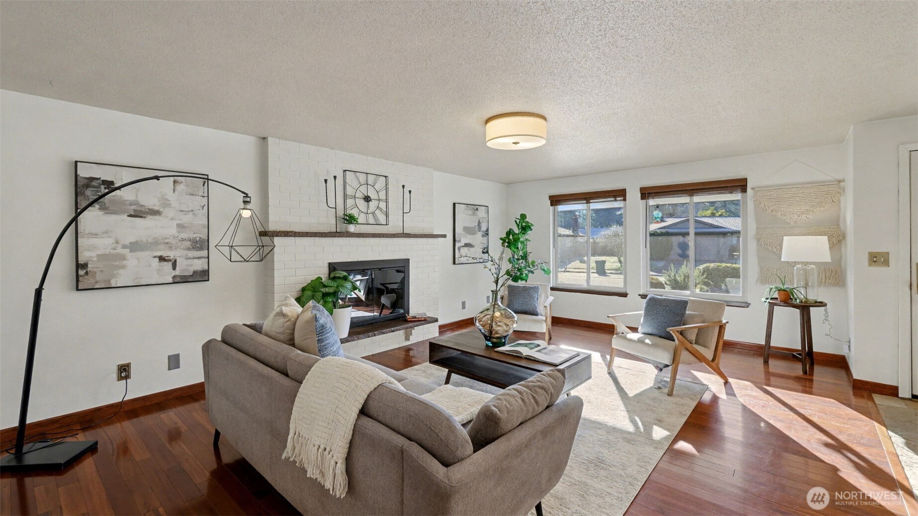 14604 Southeast 167th Place Renton, WA 98058 - Photo 4 of 23 a living room with furniture and a fireplace