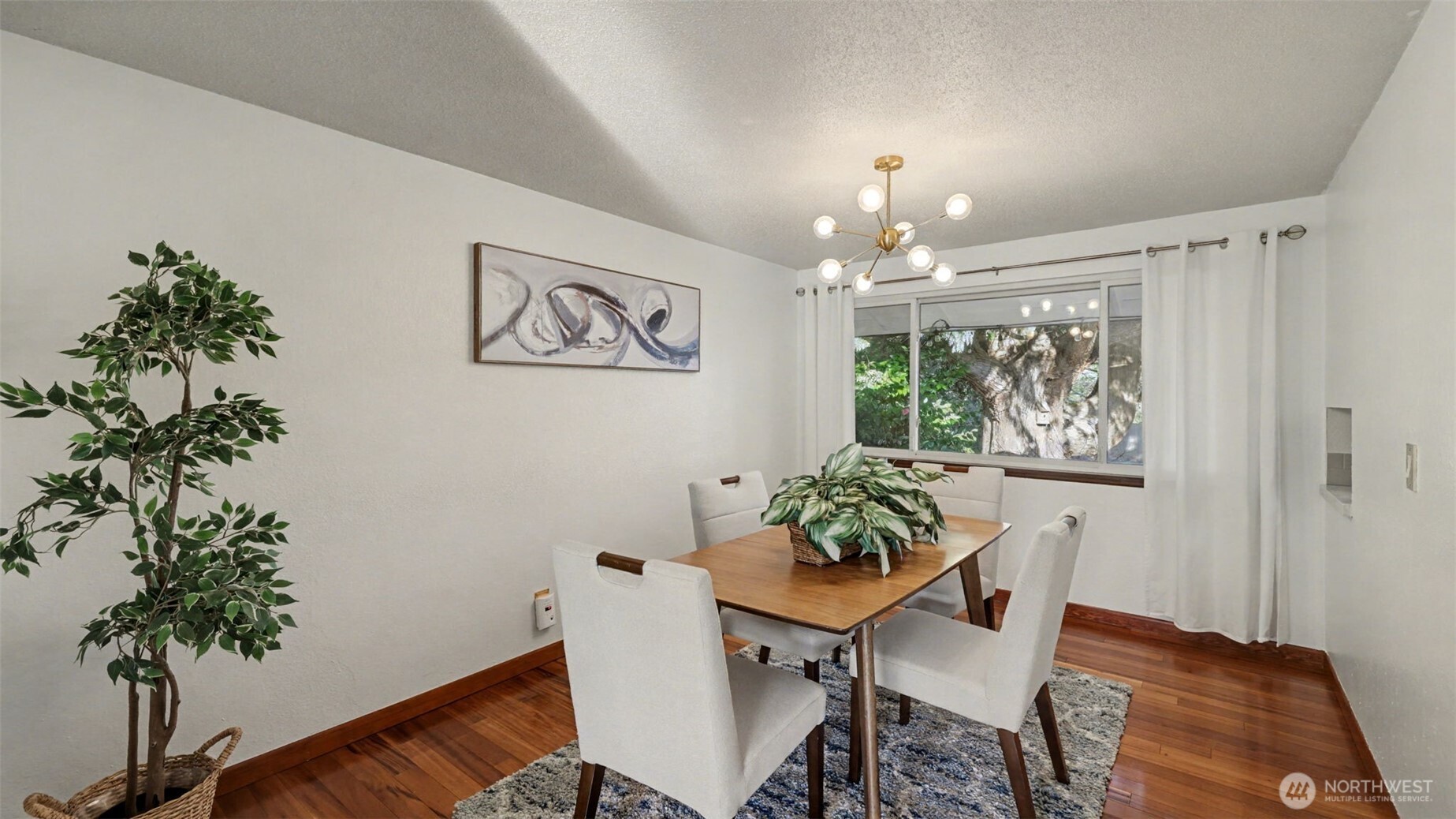 14604 Southeast 167th Place Renton, WA 98058 - Photo 6 of 23 a view of a dining room with furniture window and wooden floor