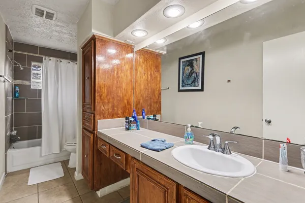 a bathroom with a sink double vanity and a mirror