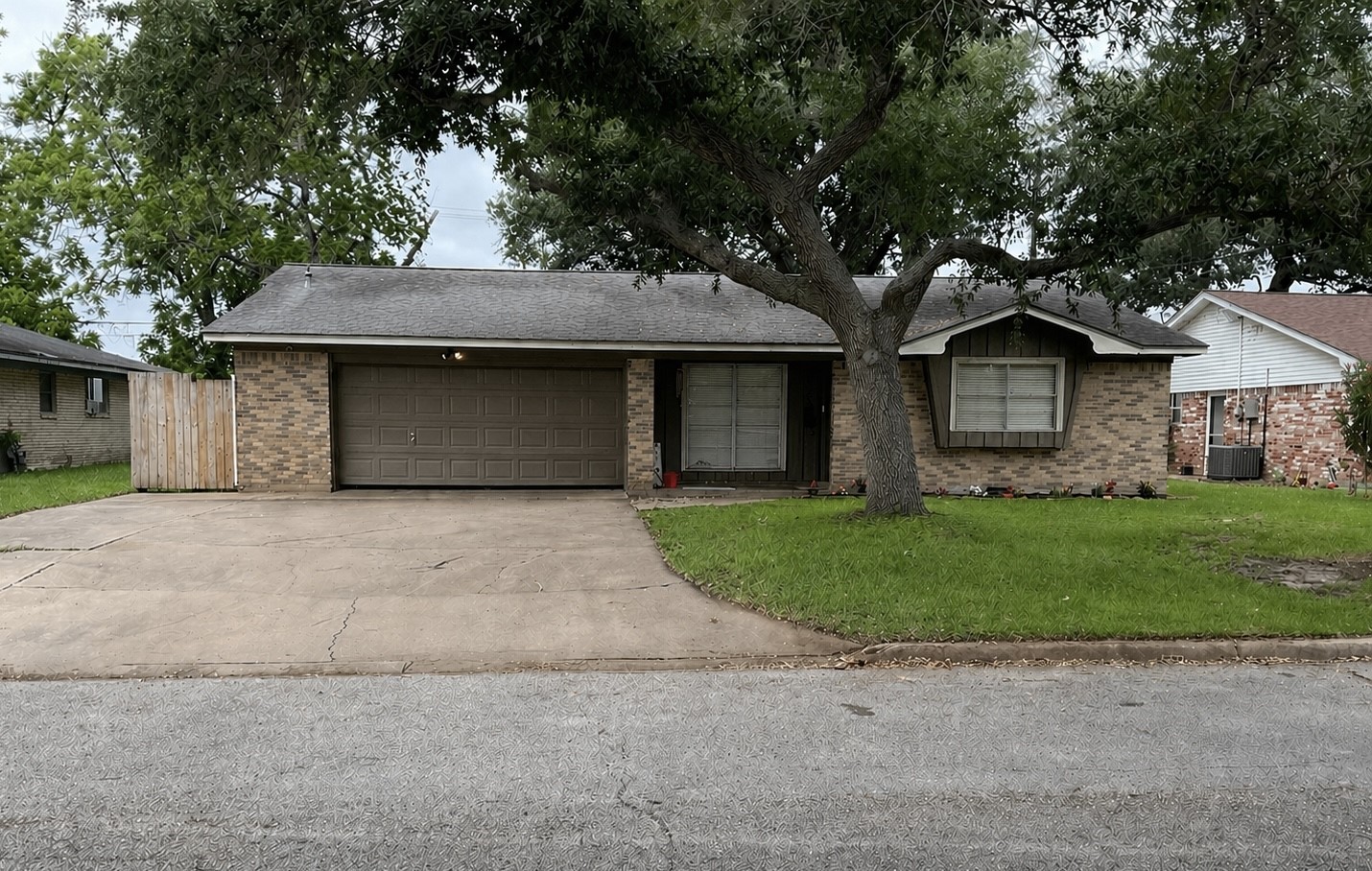 4009 Rice Avenue Bay City, TX 77414 - Photo 1 of 26 a front view of a house with a garden and trees