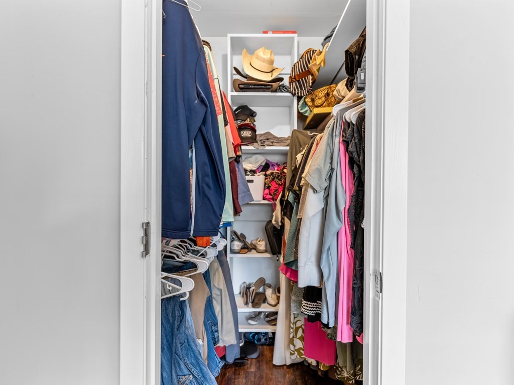 4009 Rice Avenue Bay City, TX 77414 - Photo 12 of 26 a view of walk in closet with clothes and shoes