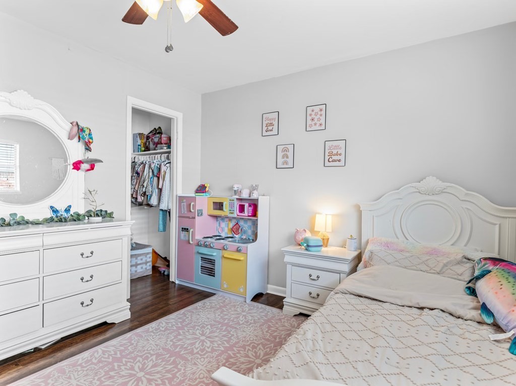 4009 Rice Avenue Bay City, TX 77414 - Photo 13 of 26 a bedroom with a bed and a dresser in it