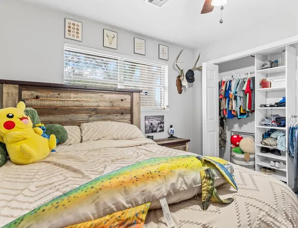 a bedroom with a bed and a closet