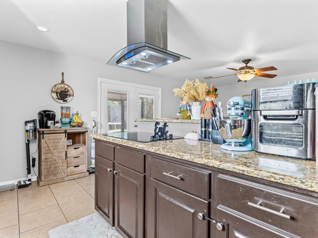 4009 Rice Avenue Bay City, TX 77414 - Photo 2 of 26 a kitchen with a sink counter top space appliances and cabinets