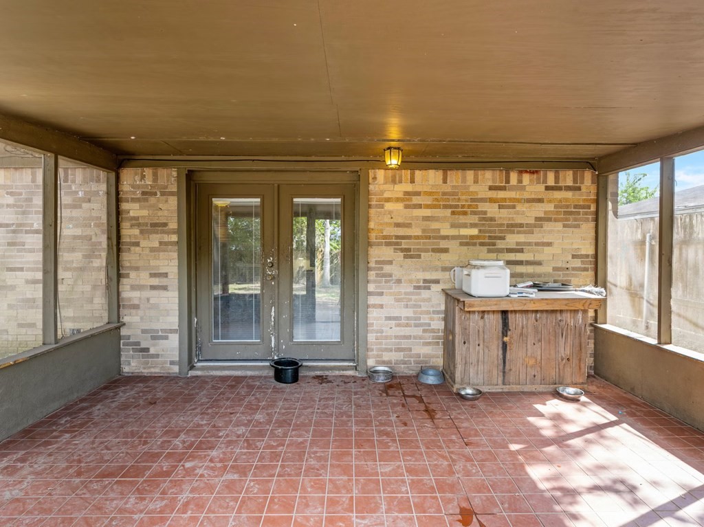 4009 Rice Avenue Bay City, TX 77414 - Photo 25 of 26 a view of an empty room with a fireplace and a large window