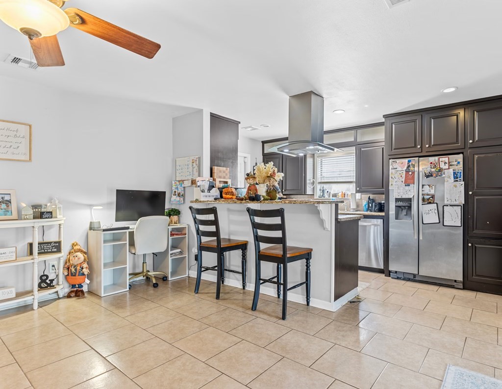 4009 Rice Avenue Bay City, TX 77414 - Photo 6 of 26 a work room with furniture and a kitchen view