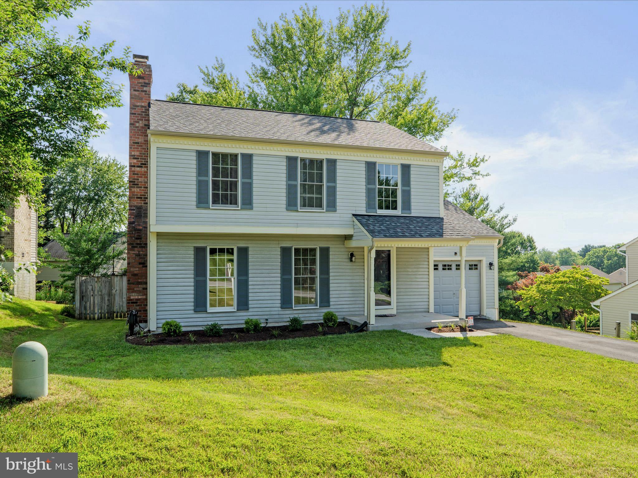a view of a house with backyard porch and garden