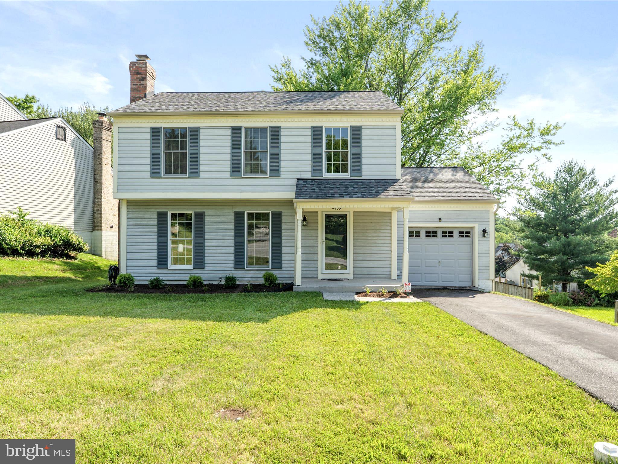 4609 Feldspar Road Middletown, MD 21769 - Photo 3 of 63 a front view of a house with a yard