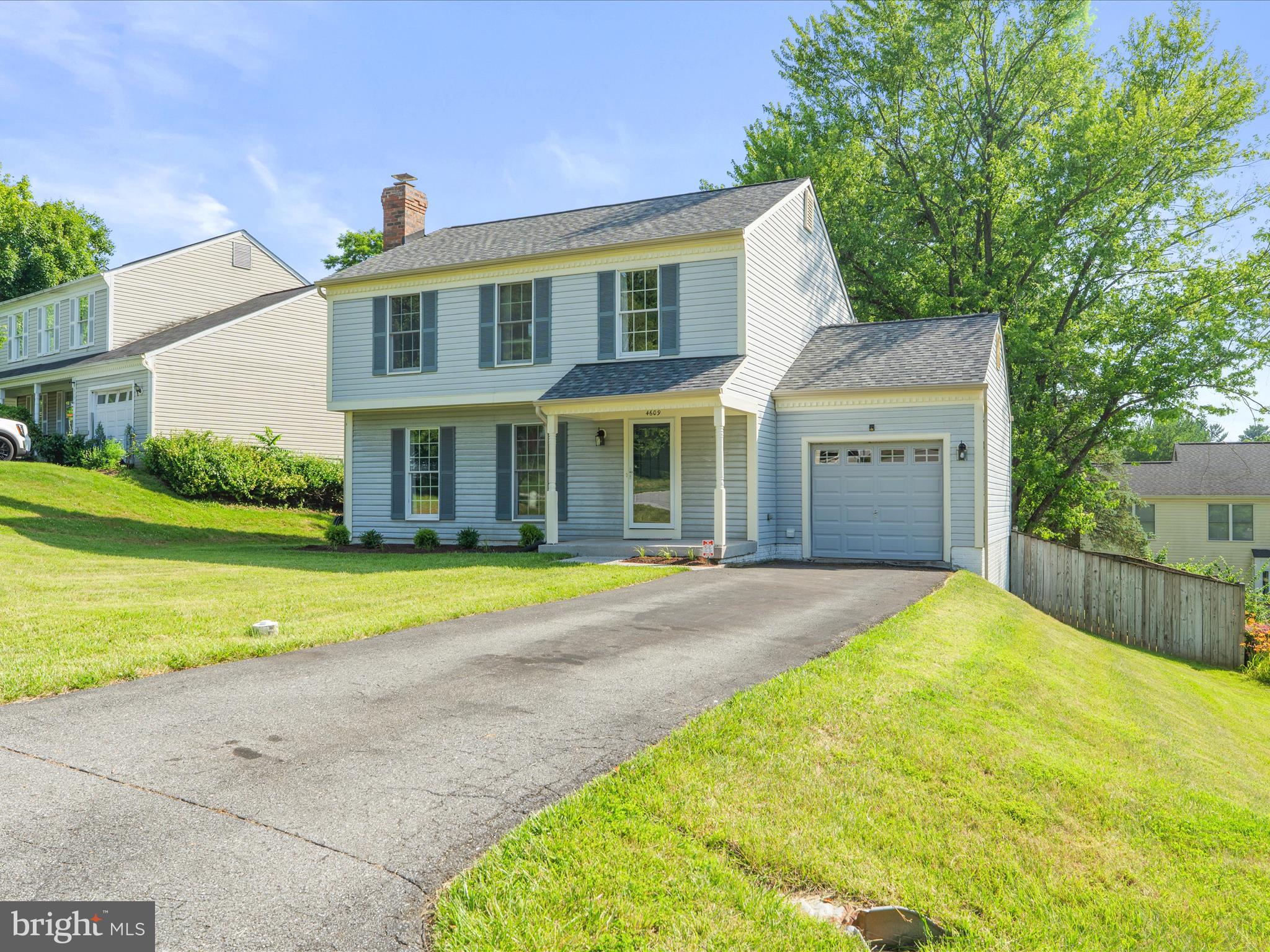 4609 Feldspar Road Middletown, MD 21769 - Photo 4 of 63 a front view of a house with a yard and garage