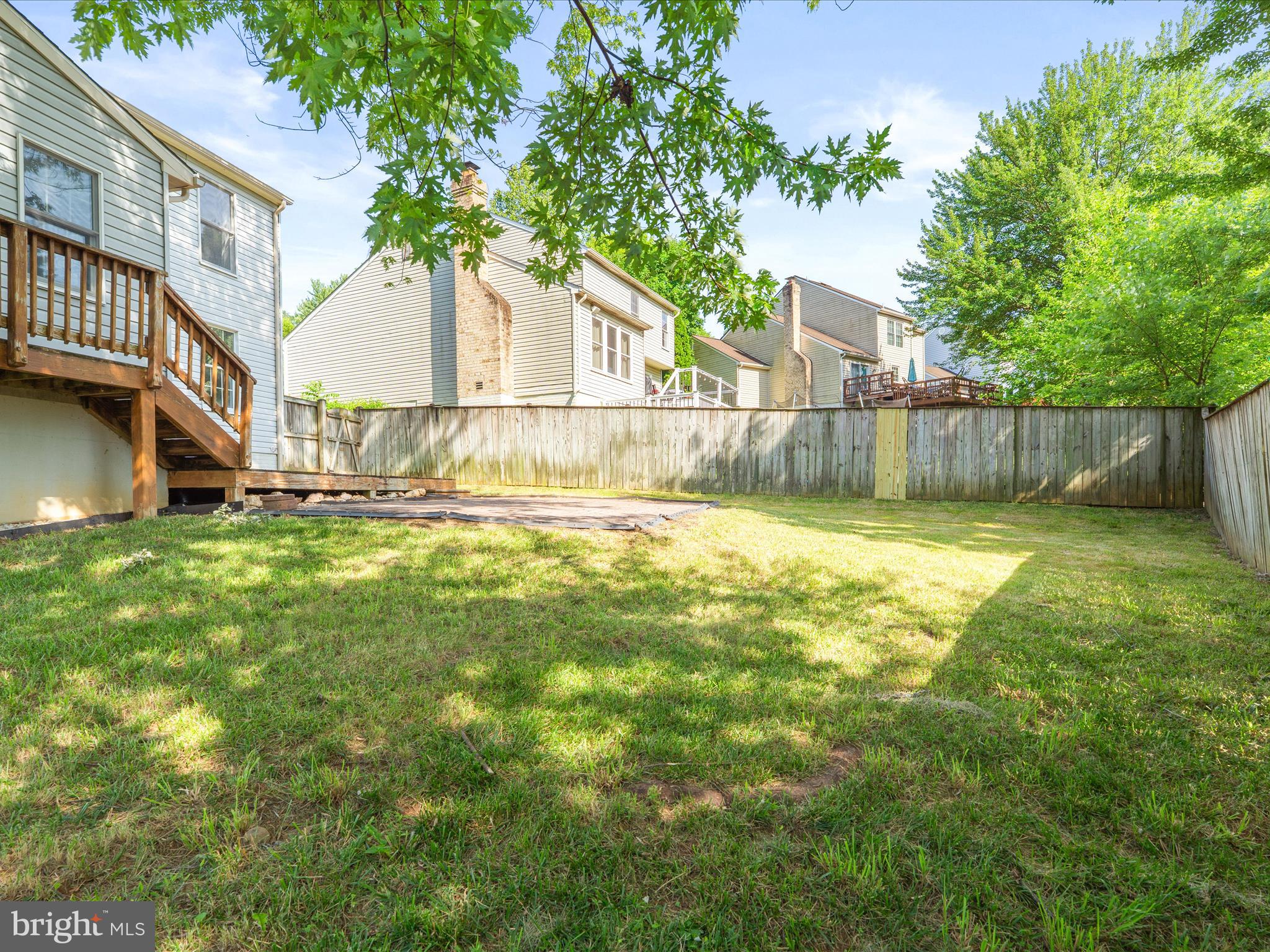 4609 Feldspar Road Middletown, MD 21769 - Photo 54 of 63 a view of a backyard with a small pool plants and large trees