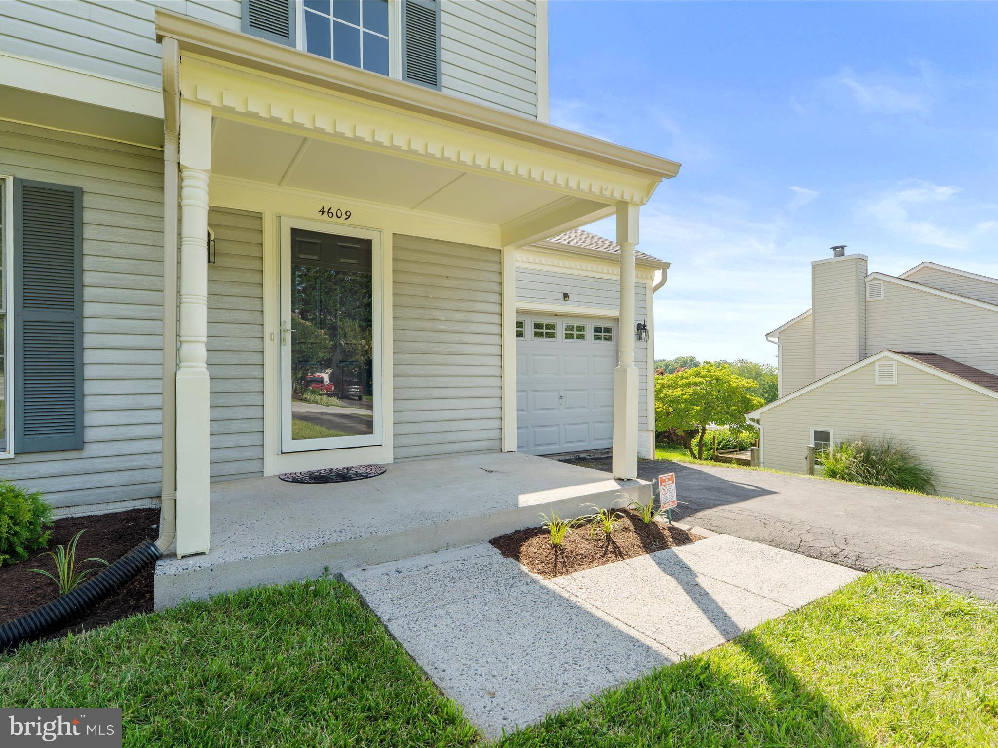 4609 Feldspar Road Middletown, MD 21769 - Photo 6 of 63 a view of a backyard with plants and a patio