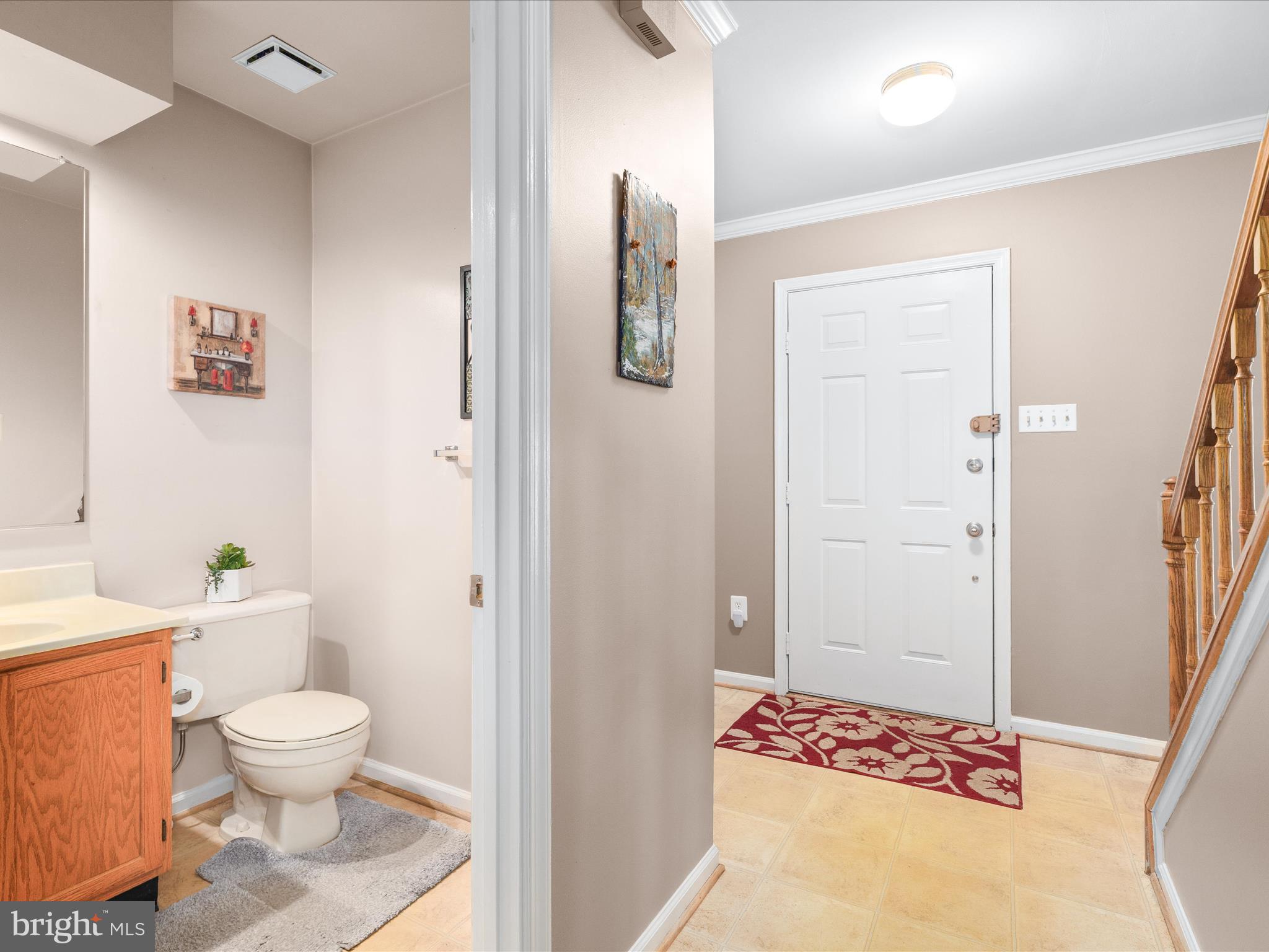 4609 Feldspar Road Middletown, MD 21769 - Photo 7 of 63 a bathroom with a toilet sink and shower