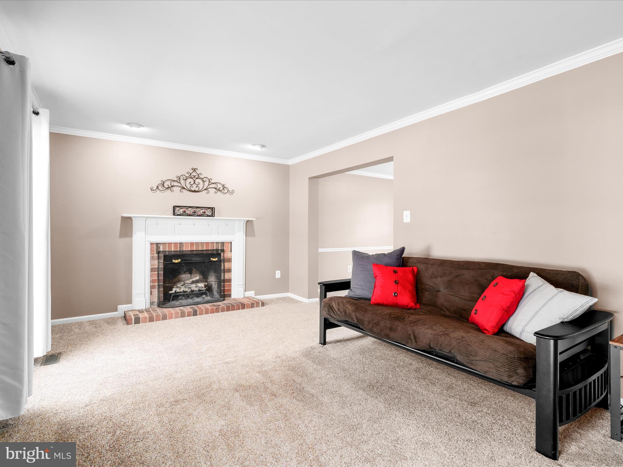 4609 Feldspar Road Middletown, MD 21769 - Photo 10 of 63 a living room with furniture and a fireplace