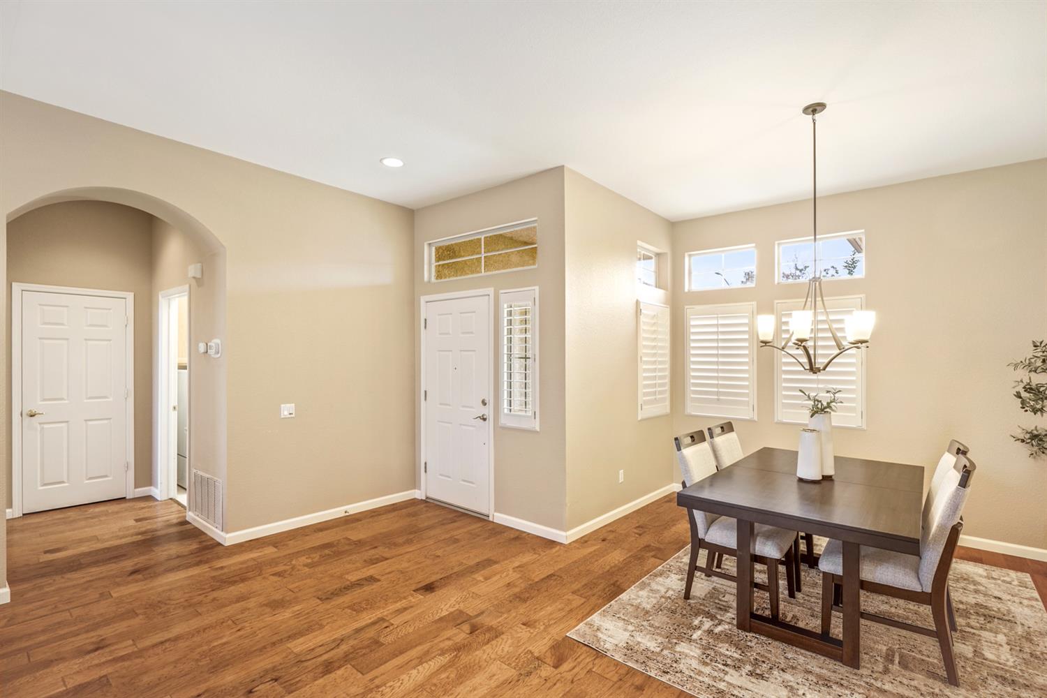 4081 Rose Creek Road Roseville, CA 95747 - Photo 5 of 52 a view of a dining room with furniture window and wooden floor