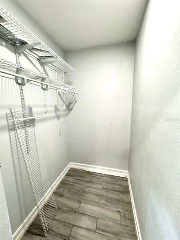 a view of a room with racks on the wall