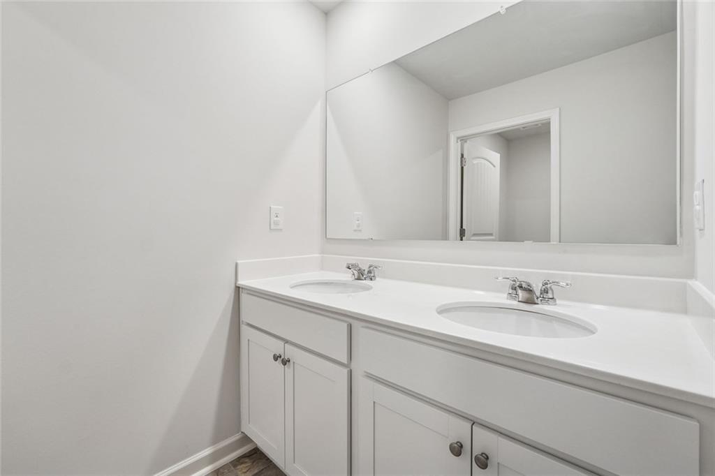 96 Quail Bend Way Dallas, GA 30157 - Photo 29 of 57 a bathroom with a sink and a mirror