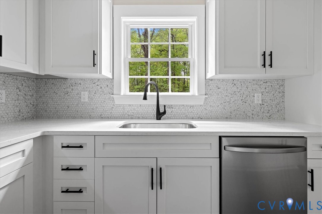2700 River Road Prince George, VA 23875 - Photo 13 of 24 a view with cabinets a window and a sink