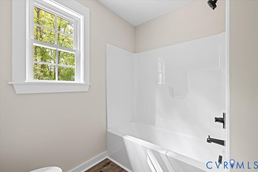 2700 River Road Prince George, VA 23875 - Photo 20 of 24 a bathroom with a window and a shower