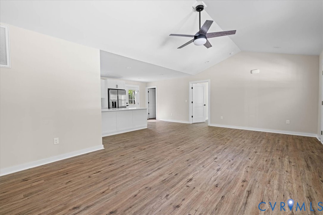 2700 River Road Prince George, VA 23875 - Photo 7 of 24 a view of room with hardwood floor and ceiling fan