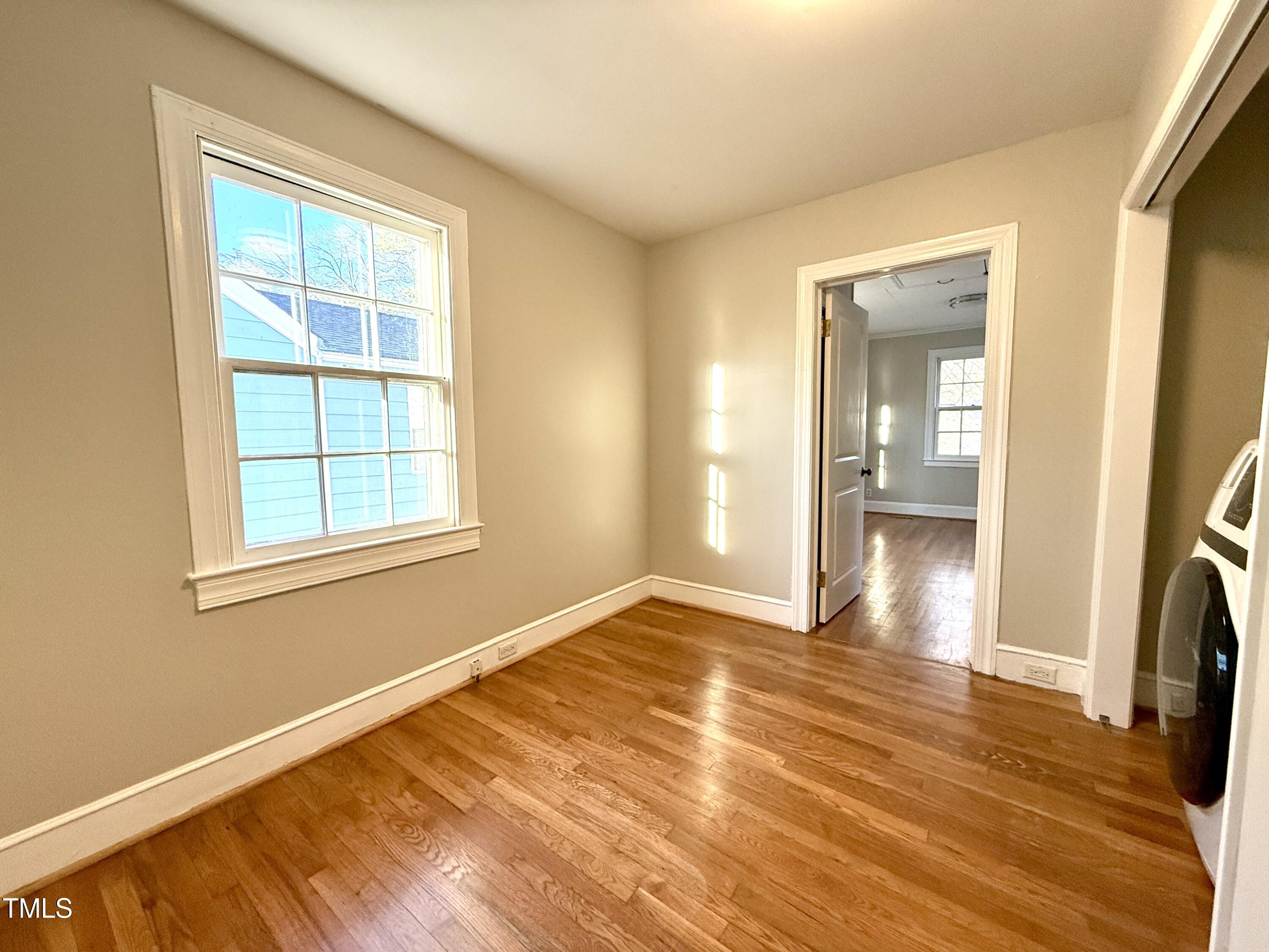 2409 Shenandoah Avenue Durham, NC 27704 - Photo 17 of 31 a view of empty room with wooden floor and fan