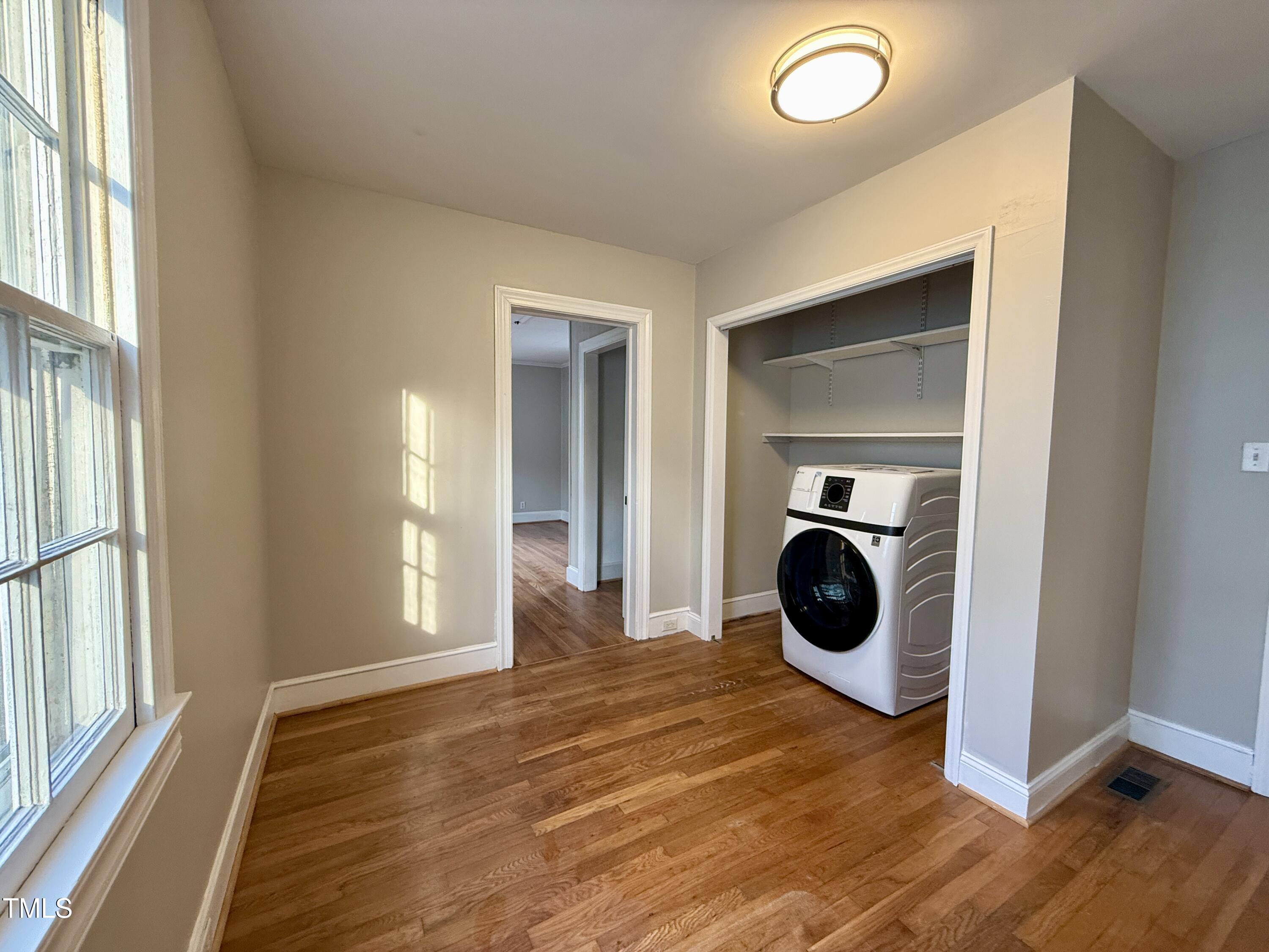 2409 Shenandoah Avenue Durham, NC 27704 - Photo 18 of 31 a view of a bedroom with washer and dryer