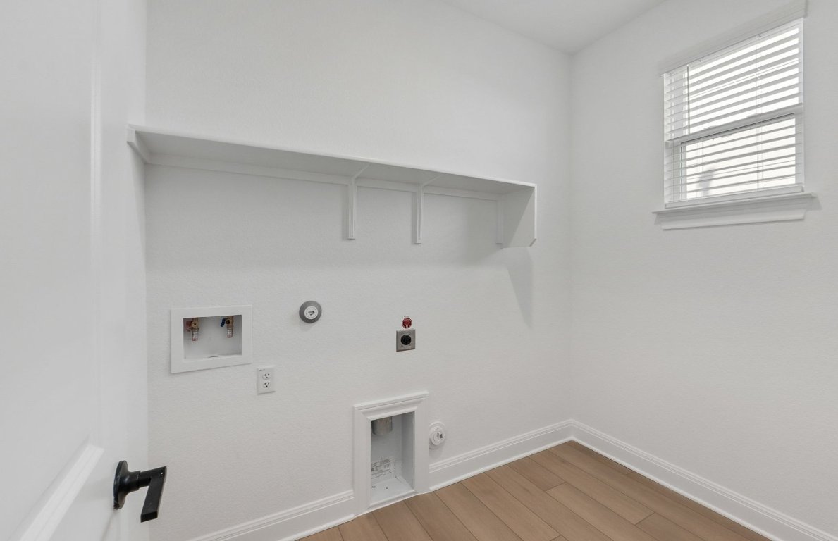 217 Regatta Trail Leander, TX 78641 - Photo 13 of 28 a view of small space with wooden floor