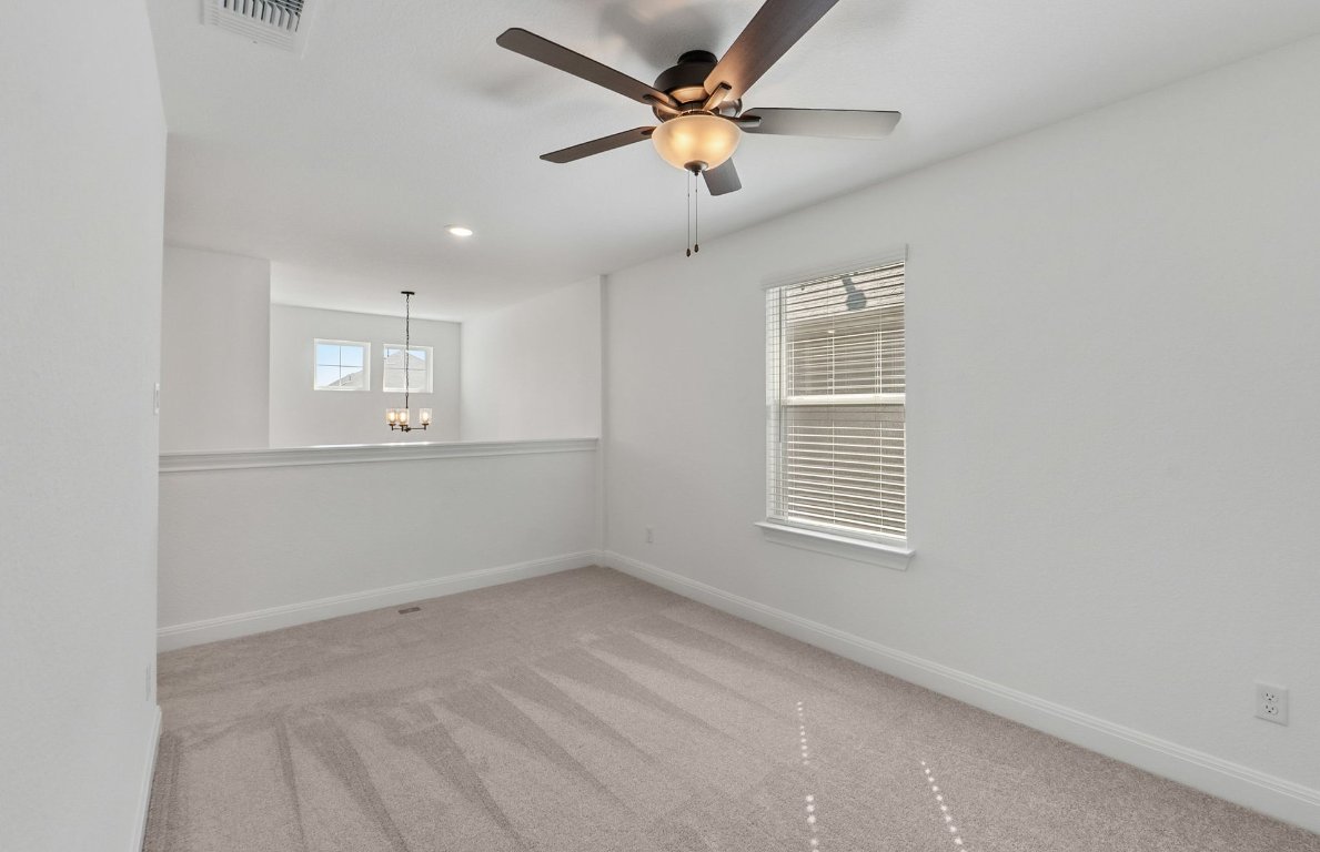 217 Regatta Trail Leander, TX 78641 - Photo 14 of 28 a view of an empty room with a window