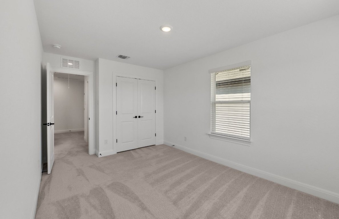 217 Regatta Trail Leander, TX 78641 - Photo 22 of 28 a view of an empty room with a window