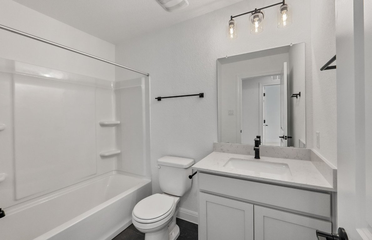 217 Regatta Trail Leander, TX 78641 - Photo 23 of 28 a bathroom with a sink toilet and shower