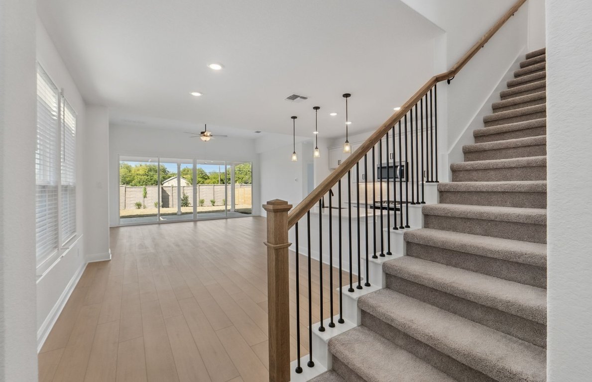 217 Regatta Trail Leander, TX 78641 - Photo 3 of 28 a view of entryway and hall with wooden floor