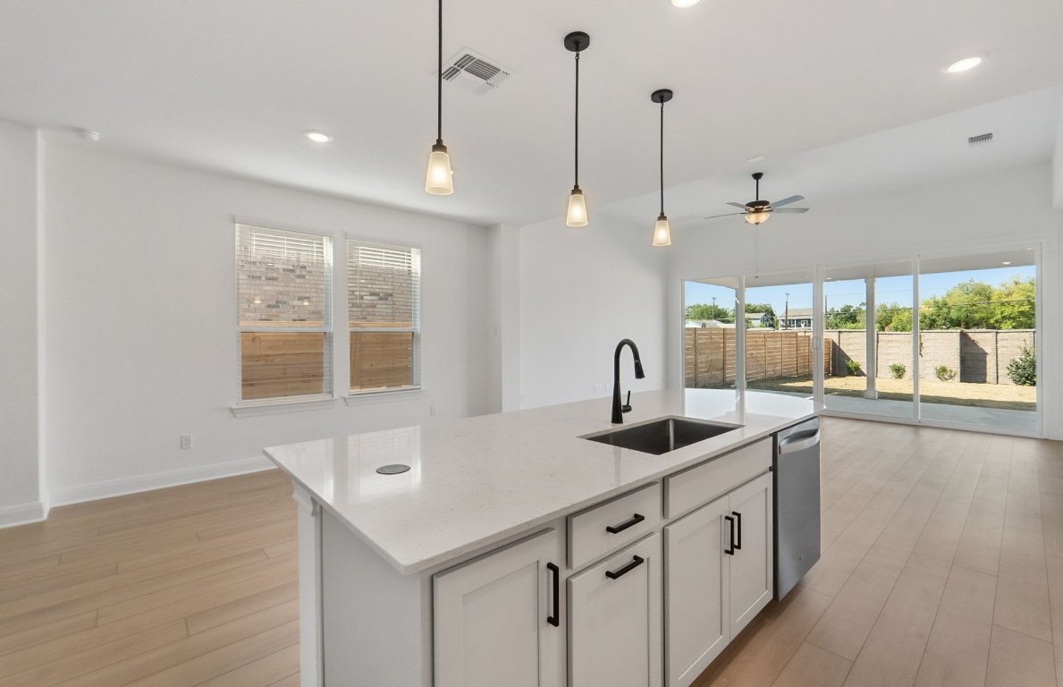 217 Regatta Trail Leander, TX 78641 - Photo 8 of 28 a kitchen with sink and window