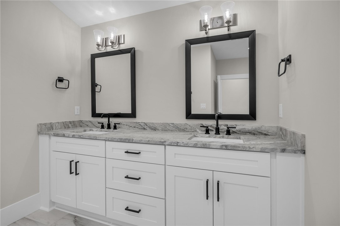 1230 Melton Road, Unit 216 West Union, SC 29696 - Photo 24 of 49 Dual vanity with elegant granite counters and sleek fixtures elevates daily routines.
