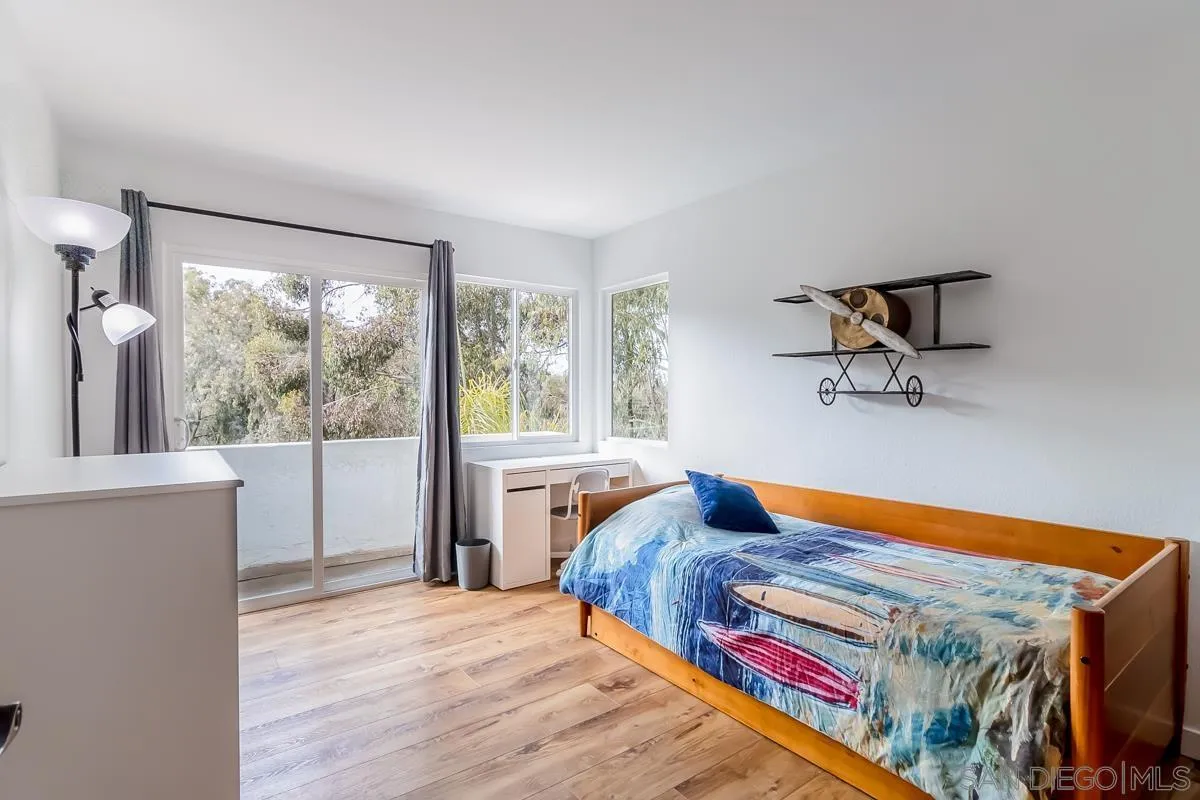 2710 Fernglen Road Carlsbad, CA 92008 - Photo 18 of 37 a bedroom with a bed and window