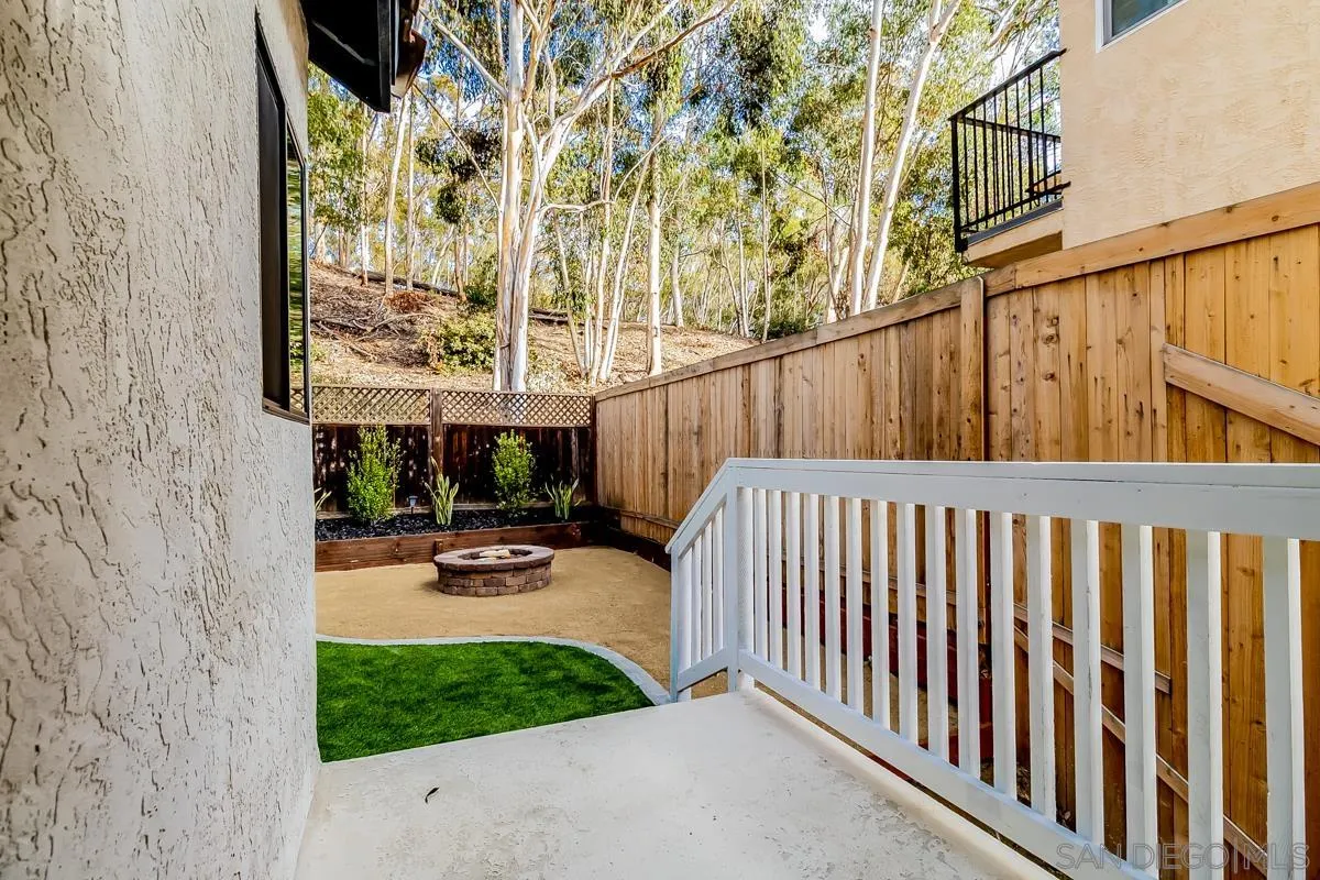 2710 Fernglen Road Carlsbad, CA 92008 - Photo 28 of 37 a view of a porch with wooden fence and floor
