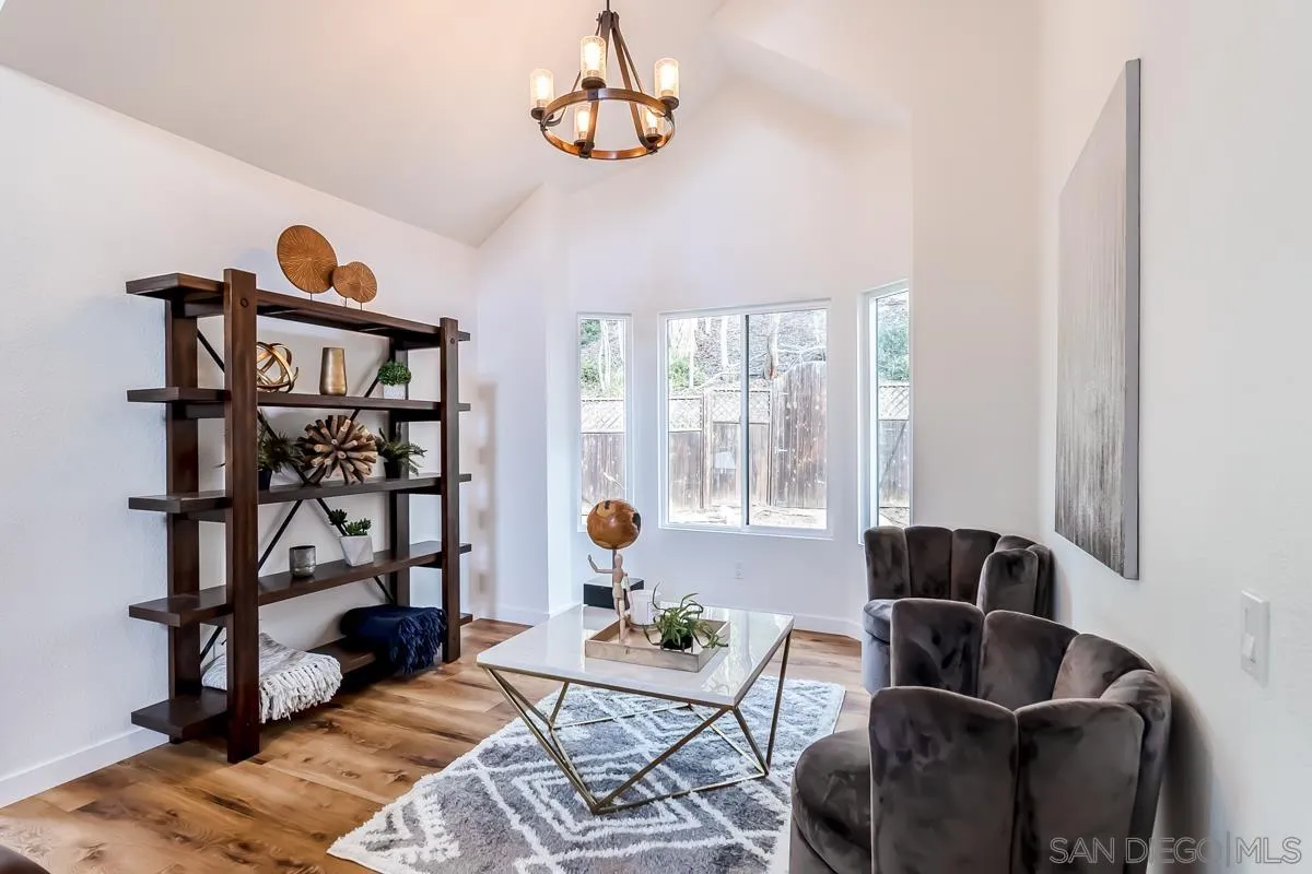 2710 Fernglen Road Carlsbad, CA 92008 - Photo 3 of 37 a living room with furniture a rug and a window