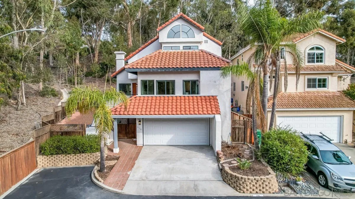 2710 Fernglen Road Carlsbad, CA 92008 - Photo 31 of 37 a front view of a house with a yard and garage