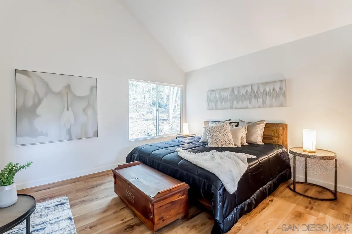 2710 Fernglen Road Carlsbad, CA 92008 - Photo 10 of 37 a large bedroom with a bed and window